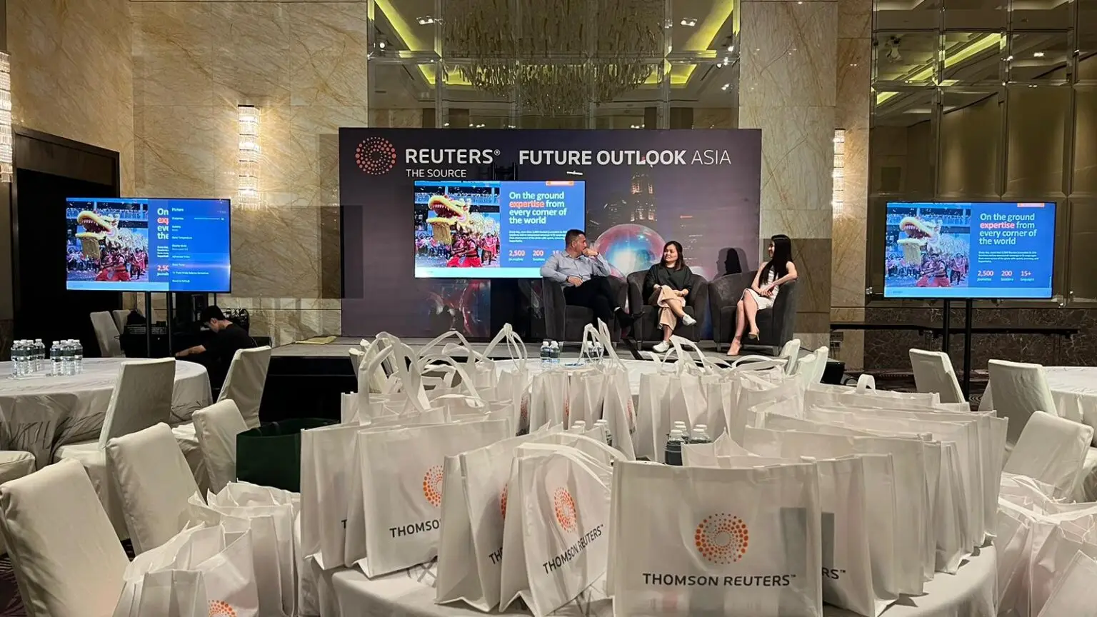 85 Inch TV rental as presentation screens for Thomson Reuters corporate event. Pictured with truss mount and spandex wrap.